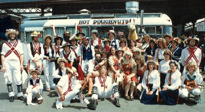 A large group of dancers pose in front of the hot doughnuts van at the Vic Market.